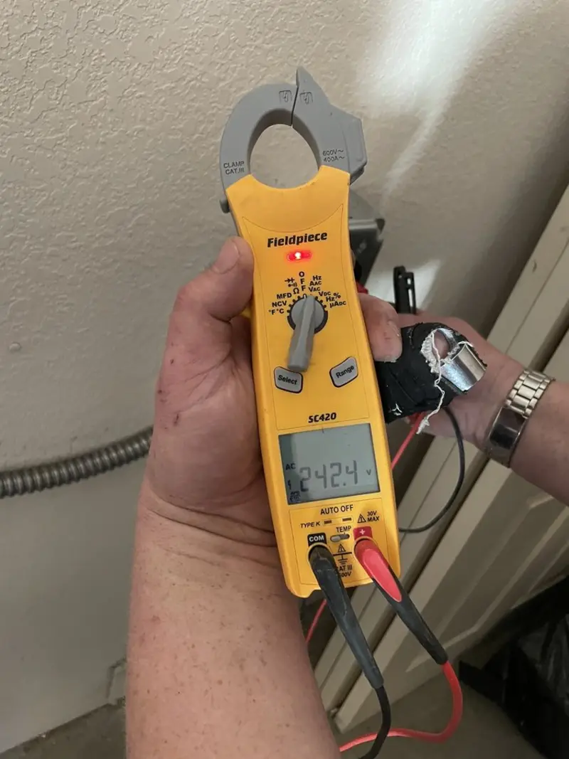 Voltage testing with clamp meter during Whole House Surge Protector in Dover
